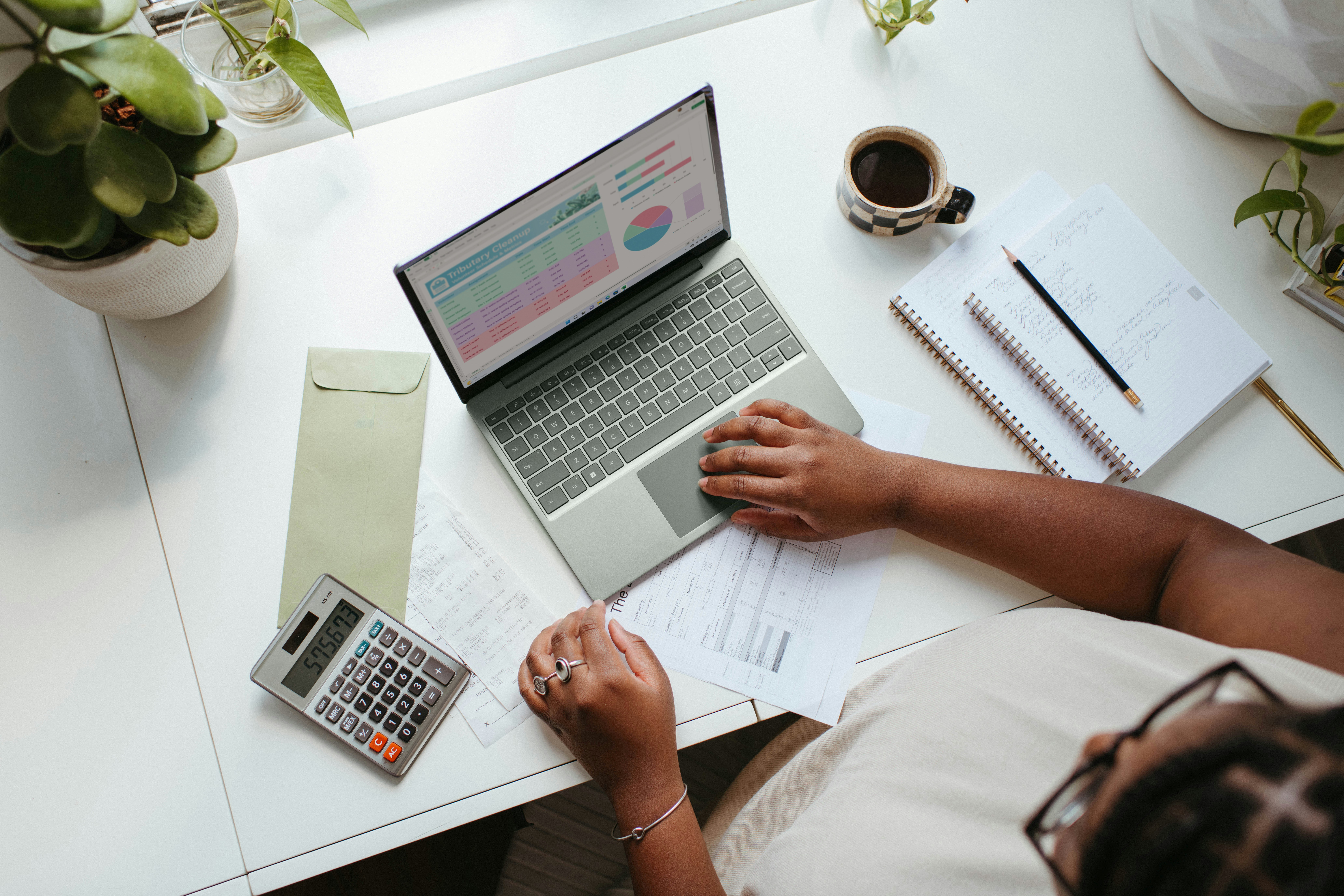 Budgeting Basics-Hero Image Woman at computer using budgeting basics to help with personal finance