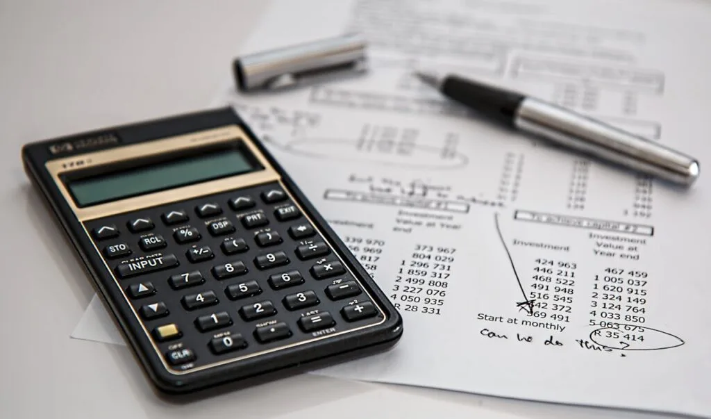 calculator-calculation-insurance-finance-53621 Close-up of financial documents with calculator and pen, ideal for business management and budgeting basics themes.