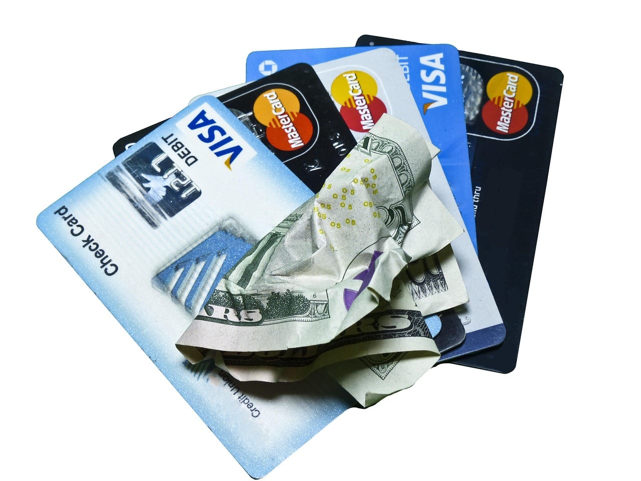 Image of credit cards and a crumpled bill for the blog post about the debt snowball method by Budget Plan Pro